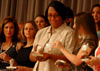 5/21/04 - Nursing graduate Ollie Herron (center) awaits the lighting of her lamp by fellow graduate Carlyn Layton during the School of Nursing's dedication and recognition service. These lamps are symbolic of those carried by Florence Nightingale as she cared for the sick and wounded during the Crimean War. 
