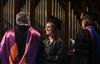 Kylie McDonald, student body president, congratulates Gavin Richardson, professor of English, on receiving the Faculty of the Year award during the annual Awards Day chapel service. - Photo by Jacob Moore