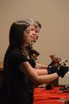Ashley Armstrong, freshman art major, Jenny Lowery, associate professor of library services, and Jenny Armstrong, junior psychology major, perform with the Handbell Choir at Luther Hall. - Photo by Jacob Moore