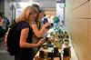 Savannah Treleven, freshman theatre/speech major, shops at the annual Mother's Day Pottery Sale hosted by the art department. - Photo by Anne Richoux