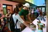 Erin Allen, freshman social work major, and Zach Thompson, sophomore biblical studies and history major, look at some of the pottery pieces at the annual Mother's Day Pottery Sale. - Photo by Anne Richoux