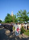 Spring graduates of the 2012 class walk in procession beside the Great Lawn before the commencement services begin. - Photo by Zac Calvert