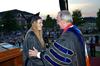 David S. Dockery, president of the university, presents the Elizabeth Tigrett Medal to Katherine Pullen, intercultural studies and journalism double major. - Photo by Morris Abernathy