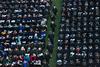 Graduates file up to the stage to receive their diplomas at spring graduation. - Photo by Kristi McMurry