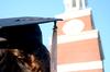 Graduates of the class of 2012 sit in front of Miller Tower on a sunny day during spring graduation.  - Photo by Ebbie Davis