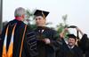 Darren Awender receives his doctor of pharmacy degree at spring graduation. The pharmacy class of 2012 was the first group to complete the program. - Photo by Jacob Moore