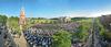 A series of seven images merged to show the great lawn full of students, family, faculty and staff gathered for May Commencement service. - Photo by Morris Abernathy