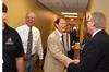 Tony Wamble, laboratory specialist, Gary Carter, senior vice president for business services, and Tim Smith, dean of the school of nursing, greet each other at the dedication ceremony for the new Hendersonville facility. - Photo by Morris Abernathy
