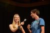 Megan Miller, senior social work major, holds the microphone for Michael Avery, freshman christian studies major, as he participates in the annual SAC game show. - Photo by Zac Calvert