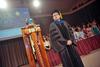 Gavin Richardson, faculty member of the year and bearer of the mace,  watches as faculty members proceed in to the George M. Savage Memorial Chapel for Fall Convocation. - Photo by Morris Abernathy
