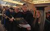 Randy Johnston, professor of chemistry and department chair, and Anika Strand, senior class president, sing during Fall Convocation. - Photo by Morris Abernathy