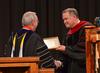 David S. Dockery, president of the university, installs Todd Brady as the  new vice president for church relations during Fall Convocation. - Photo by Morris Abernathy