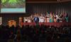 Chris Mathews, associate professor of music and department chair, leads the University Singers during Fall Convocation. - Photo by Morris Abernathy