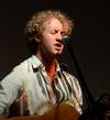 Zac Lancaster, freshman digital media studies major, serenades his freshmen classmates during Open Mic Night for new students during Focus weekend.  - Photo by Ebbie Davis