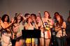 The 2012 Focus leaders preform a Disney throw-back song, "I'll make a man out of you" during the special Open Mic Night for new students. - Photo by Ebbie Davis