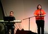 Caylee Dugger, freshman music performance major, accompanied on the keyboard by Greg Hines, senior music performance major, sings the award winning "Popular" from Wicked, grabbing the audience's attention during Focus week Open Mic Night.  - Photo by Ebbie Davis