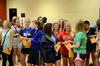 Students laugh and talk with each other as they eagerly await the chance to open their bid card envelopes during Panhellenic Bid Day.  - Photo by Anne Richoux