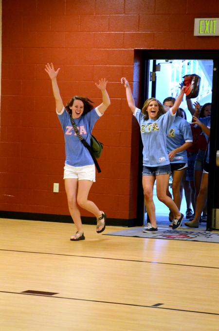 Panhellenic council members and Rho Chis reveal which sorority they are in during Bid Day.