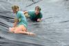 Seniors Elizabeth Cochran and Hillary Craft laugh as they go down the slip 'n slide during Panhellenic Bid Day. - Photo by Anne Richoux