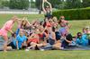 Members of Zeta Tau Alpha celebrate Panhellenic Bid Day together on a slip 'n slide.  - Photo by Anne Richoux