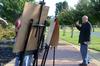 Chris Nadaskay, university professor of art, instructs his drawing students to focus on the negative space while sketching the trees on campus.  - Photo by Ebbie Davis