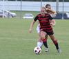 Megan Roney attacks the ball against the offense to get possession back. Union's women soccer team came out strong to defeat Belhaven University with a score of 1-0. - Photo by Ebbie Davis
