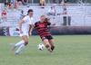 Megan Roney attacks the ball against the offense to get possession back.  - Photo by Ebbie Davis