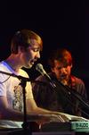 Evan Estes, sophomore advertising major, and Jay Griffith, junior English major, both members of the band Wolvski, perform in Barefoots Joe. - Photo by Zac Calvert