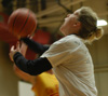 Women's assistant basketball coach Katie Woodruff (Coach K) goes up for a layup in an intramural basketball game. - Photo by Jonathan Blair