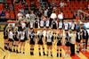 The Lady Bulldog and the University of West Florida volleyball teams join together for a time of prayer following their match. - Photo by Anne Richoux