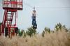 Molly Priddy, senior sociology major, enjoys the zip line at Union Night during Family Weekend.  - Photo by Anne Richoux