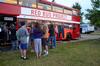 Family members and students stand in line to shop for clothing from the Red Bus Project at Union Night during Family Weekend. - Photo by Anne Richoux