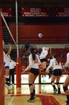 Savannah Hughes, sophomore biology major, leaps up to spike the ball during a game against University of Alabama-Huntsville. - Photo by Zac Calvert