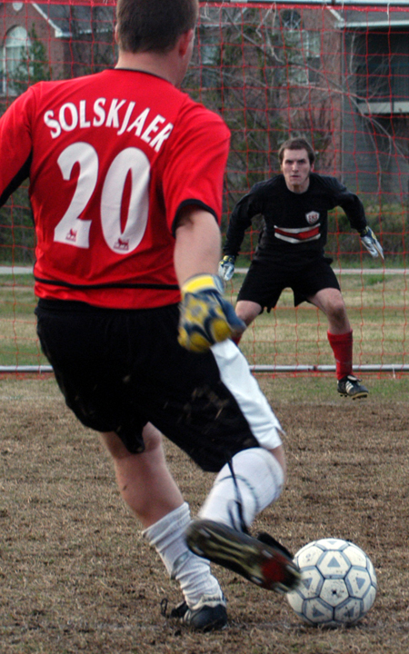 Onion goalkeeper Patrick Myers braces himself for Jacob O'Brien's shot during an intramural soccer game.