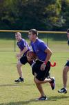 Craig Davis, senior sports medicine, makes a run with the football in intramural flag football during Family Weekend. - Photo by Zac Calvert
