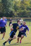 Jake Ryan, senior business administration major, runs with the football as Nathan Bibb, senior sports medicine major, tries to pull one of his  flags in an intramural game during Family Weekend. - Photo by Zac Calvert