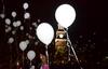 Homicide-loss survivors release white balloons at the end of the fifth annual Remember Me Commemorative Walk. - Photo by Jacob Moore