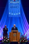 Robert M. Gates, former U.S. secretary of defense, cracks up while talking about his love-hate relationship with Texas A&M's football team while answering questions at the 15th Annual Scholarship Banquet.  - Photo by Ebbie Davis