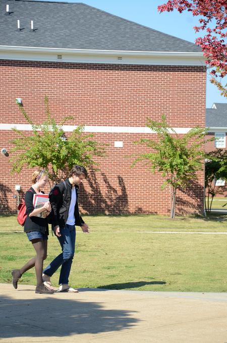 Juniors Hilary Borden, art major, and Jay Griffith, English major, walk across campus on a gorgeous Fall day. 