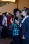 Christine Ryan, junior Christian studies major, and Cari Phillips, sustainability coordinator, sing along during worship in the final chapel of Faith in Practice week.  - Photo by Anne Richoux