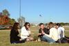Elizabeth Oakes, Rachel Robbins, Peter Riggs, Caisie Jordan and Will Burke chat and laugh together during the pre-game tailgate celebrating Senior Night for the soccer teams. - Photo by Anne Richoux