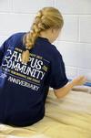 11/6/12 - McKenzie Dorris, junior mathematics major, paints the trim in the youth room at Cornerstone Baptist Church. Dorris was joined by her LIFE group to work in the tenth annual Campus and Community Day.  - Ebbie Davis