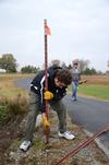 11/6/12 - Lowell Van Ness, senior history major, works with the history department on the grounds of Parker's Crossroads Battlefield in Henderson County during Campus and Community Day. - Jacob Moore