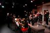 David McClune, university professor of music, leads the jazz band in a warm up before their concert. - Photo by Anne Richoux