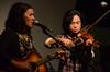 Musician Carlo Canlas accompanies Jenny Moscoso of Seryn during an opening act at a Barefoots Joe concert. - Photo by Olivia Wallace