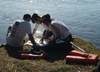 Senior Steve Yzaguirre, engineering major, sophomore Chris Arnold, Christian studies major, and freshman Mike Yzaguirre, sociology major, pore over a map during an adventure race April 3. - Photo by Kristen Hiller