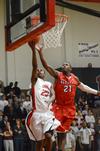 Corieon Pearson goes up for a shot against Valdosa State's Alan Love during Union's first game as a member of the Gulf South Conference. - Photo by Jacob Moore