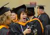 Tracie Woodward, master of science in nursing graduate, laughs at a photo taken of fellow graduates prior to Fall Commencement. - Photo by Jacob Moore