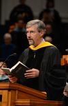 Paul Deschenes, director of counselor services, reads from 1 Corinthians 13 during Fall Commencement. - Photo by Jacob Moore
