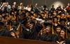 Students cheer at the conclusion of Fall Commencement. - Photo by Jacob Moore